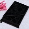 Minimalist-Black-Prayer-Rug-with-Blossoms-and-Lantern